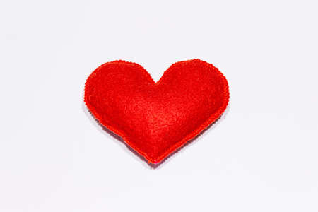 Red felt heart isolated on white background. Valentines Day or Wedding romantic conceptの写真素材