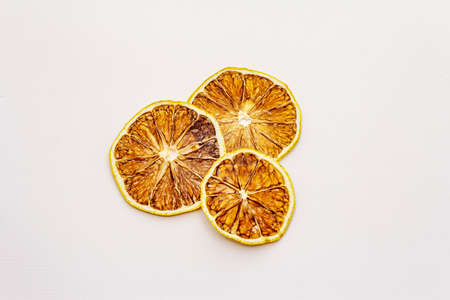 Dried slices of lemon isolated on white background. Healthy eating concept, close upの写真素材
