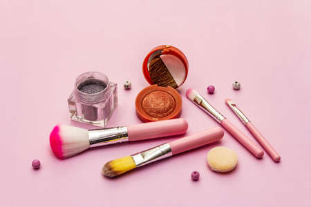 Makeup cosmetic set on pink background. Professional decorative cosmetics, beauty blogger concept, close upの写真素材