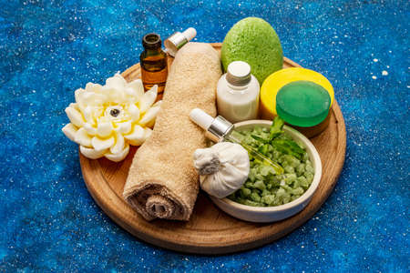 Healthy ritual of taking care of yourself. Natural cosmetics, spa set. Essential oils, sea salt, cream, sponge, towel. Nautical background, close upの写真素材