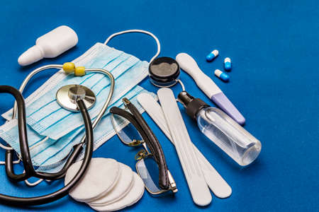 Set of diverse medical items. Means for the prevention, personal hygiene and treatment of the symptoms of coronavirus. COVID-19 pandemic, 2019-nCoV worldwide concept. Trendy blue color backgroundの写真素材
