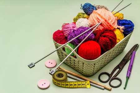 Handmade, DIY concept. Set of tools and materials for knitting. Stay at home in quarantine. Wooden boards backgroundの写真素材