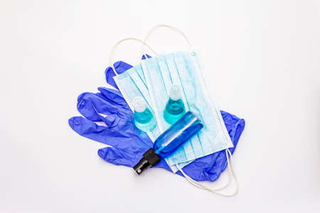 Mask, gloves, sanitizer isolated on white background. Medical products for personal hygiene and the prevention of viral diseases. Coronavirus, COVID-19 pandemic, 2019-nCoV worldwide conceptの写真素材