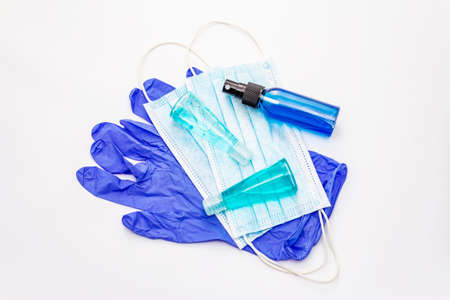 Mask, gloves, sanitizer isolated on white background. Medical products for personal hygiene and the prevention of viral diseases. Coronavirus, COVID-19 pandemic, 2019-nCoV worldwide conceptの写真素材
