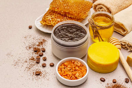 Spa concept. Self care with honey, coffee and turmeric. Natural organic cosmetics, homemade product, alternative lifestyle. White putty backgroundの写真素材