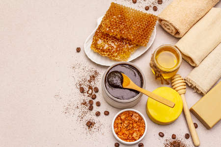 Spa concept. Self care with honey, coffee and turmeric. Natural organic cosmetics, homemade product, alternative lifestyle. White putty backgroundの写真素材