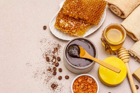 Spa concept. Self care with honey, coffee and turmeric. Natural organic cosmetics, homemade product, alternative lifestyle. White putty backgroundの写真素材