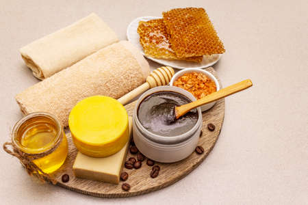 Spa concept. Self care with honey, coffee and turmeric. Natural organic cosmetics, homemade product, alternative lifestyle. White putty backgroundの写真素材