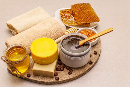 Spa concept. Self care with honey, coffee and turmeric. Natural organic cosmetics, homemade product, alternative lifestyle. White putty backgroundの写真素材