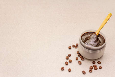 Spa concept. Self care with coffee body scrub. Natural organic cosmetics, homemade product, alternative lifestyle. White putty backgroundの写真素材