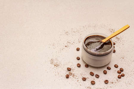 Spa concept. Self care with coffee body scrub. Natural organic cosmetics, homemade product, alternative lifestyle. White putty backgroundの写真素材