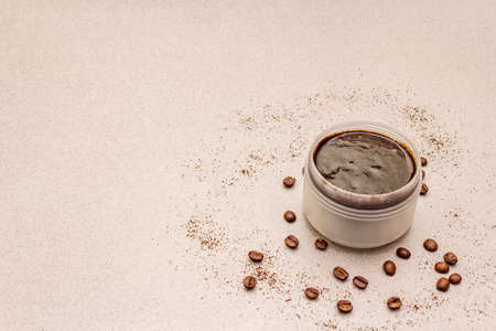 Spa concept. Self care with coffee body scrub. Natural organic cosmetics, homemade product, alternative lifestyle. White putty backgroundの写真素材