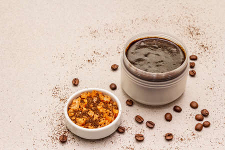 Spa concept. Self care with coffee body scrub and sea salt. Natural organic cosmetics, homemade product, alternative lifestyle. White putty backgroundの写真素材