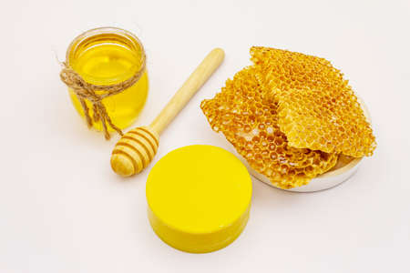 Honey, beeswax and honeycombs isolated on white background. Sweet healthy bee productsの写真素材