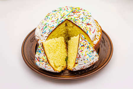 Easter cake isolated on white background. Traditional Orthodox festive bread, cut piecesの写真素材