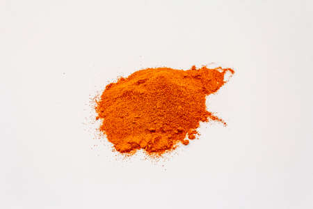 Hungarian sweet paprika powder isolated on white background. Heap of traditional seasoningの写真素材
