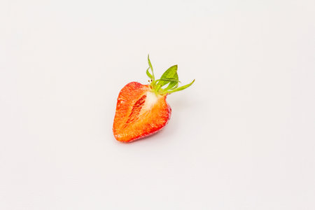 Half sweet fresh strawberry isolated on white background. Ripe berries fruit tasty ingredient for...