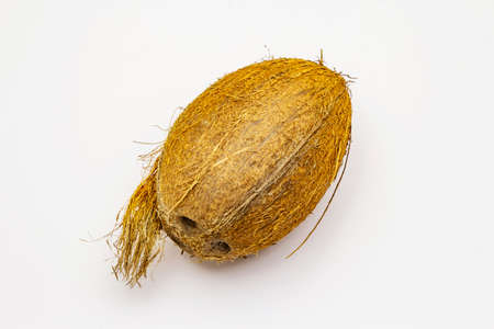 Fresh ripe coconut isolated on white background. Whole fruit, ingredient for healthy and beauty lifeの写真素材