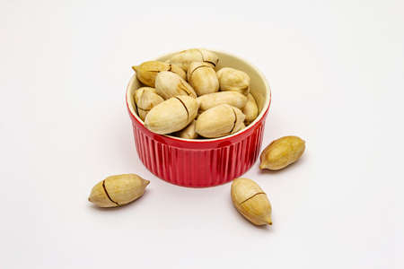 Ripe pecan isolated on white background. Traditional ingredient for pecan pie in USAの写真素材