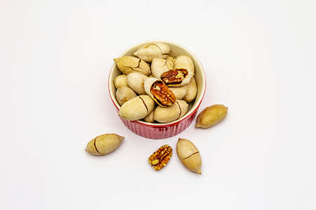 Ripe pecan isolated on white background. Traditional ingredient for pecan pie in USAの写真素材