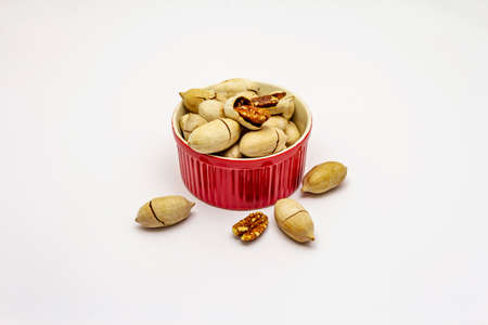 Ripe pecan isolated on white background. Traditional ingredient for pecan pie in USAの写真素材