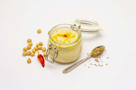 Hummus isolated on white background. Dry chickpea, cumin and chili pepper. Traditional food in Middle Eastern and Mediterranean cuisineの写真素材