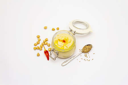 Hummus isolated on white background. Dry chickpea, cumin and chili pepper. Traditional food in Middle Eastern and Mediterranean cuisineの写真素材