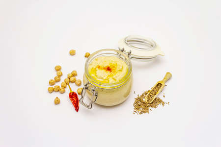 Hummus isolated on white background. Dry chickpea, cumin and chili pepper. Traditional food in Middle Eastern and Mediterranean cuisineの写真素材