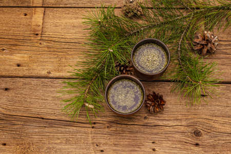 Pine needle tea, sollip-cha, traditional Korean beverage. Alternative medicine, healthy life style. Vintage wooden boards backgroundの写真素材