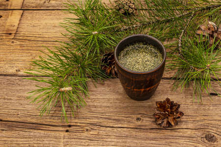 Pine needle tea, sollip-cha, traditional Korean beverage. Alternative medicine, healthy life style. Vintage wooden boards backgroundの写真素材