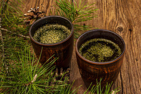 Pine needle tea, sollip-cha, traditional Korean beverage. Alternative medicine, healthy life style. Vintage wooden boards backgroundの写真素材
