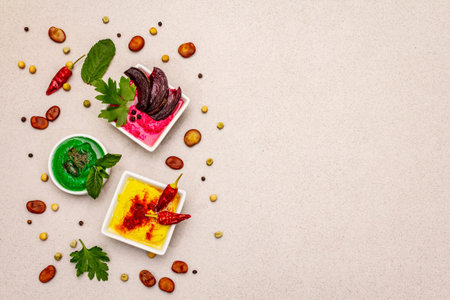 Hummus, healthy vegan (vegetarian) food. Assorted three types: classic, mint and beetroot. Edamame...