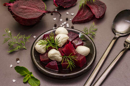 Culinary background. Cooking food concept. Healthy salad with baked beetroot, baby mozzarella, fresh...