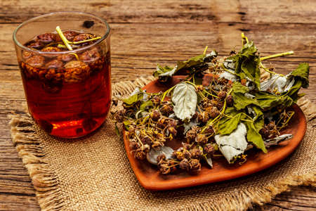 Dry leaves, flowers and berries of raspberry. Herbal ingredient for cooking healthy tea, alternative...