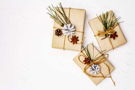 Zero waste gift concept. Christmas or New Year decor from pine branches and cones, star anise and...