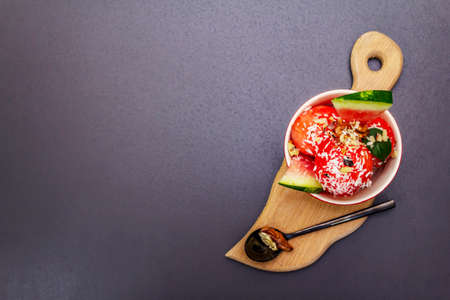 Watermelon ice cream or sorbet with coconut flakes, walnuts and fresh basil leaves. Sweet healthy...