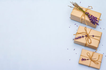 Zero waste gift concept. Creative arrangement of craft boxes and fragrant fresh lavender. Gentle...