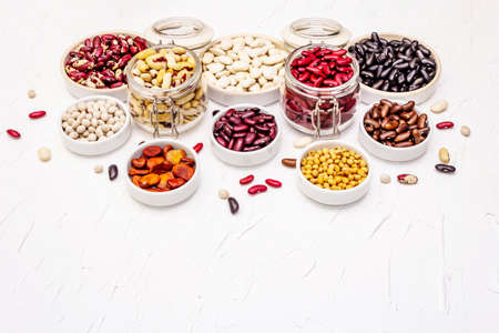 Assorted different types of beans. Set of various dry legumes, indispensable protein for a healthy vegan lifestyle, copy spaceの写真素材
