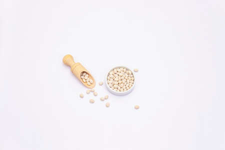 Dry white beans isolated on white background. A traditional ingredient in healthy food preparationの写真素材
