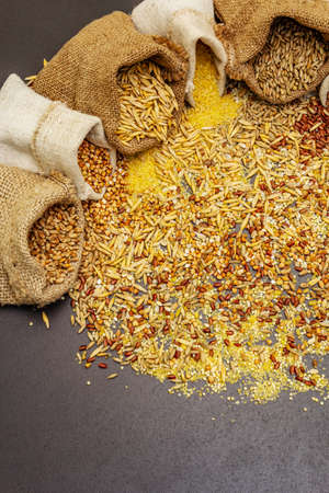 Assorted variety of cereals in handmade sacks. Mix of indispensable ingredients for a healthy diet....