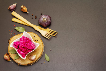 Homemade sauerkraut village fermented red cabbage. Vegan salad rustic style in ceramic bowl. Fermented food great for good health. Traditional rustic winter food. Probiotics food concept, top viewの写真素材