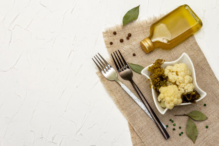 Homemade sauerkraut village fermented cauliflower. Vegan salad rustic style in ceramic bowl. Fermented food great for good health. Traditional rustic winter food. Probiotics food concept, top viewの写真素材