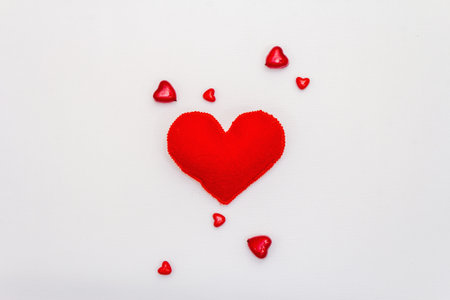 Red hearts isolated on white background. Valentine's day or Wedding romantic concept, top view, copy space, flat layの写真素材
