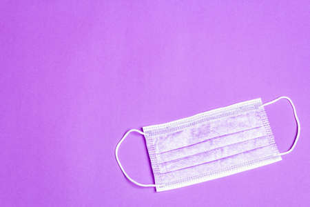 Fashion lilac masks isolated on glamor purple background. Medical products for personal hygiene and the prevention of viral diseases. Coronavirus, COVID-19 pandemic worldwide conceptの写真素材