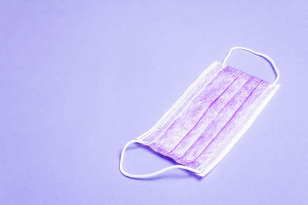 Fashion lilac masks isolated on glamor purple background. Medical products for personal hygiene and the prevention of viral diseases. Coronavirus, COVID-19 pandemic worldwide conceptの写真素材