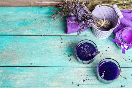 Lavender tonic drink on wooden table. Natural organic flower drink for morning good mood, dry bouquet, fragrant candle, top viewの写真素材