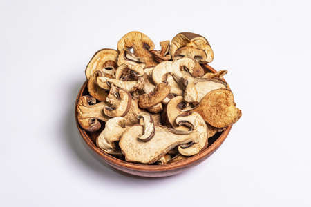 Dried mushrooms Boletus edulis (Penny bun, Cep, Porcini) isolated on white background. Ingredient...