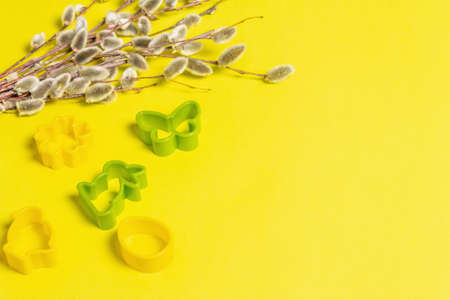 Easter baking concept isolated on sunny yellow background. A set of cookie cutters in the form of...
