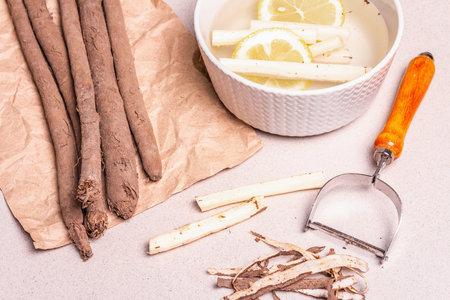 Raw Scorzonera or Spanish salsify. Process for cooking. Peel skin, and place in cold water with...