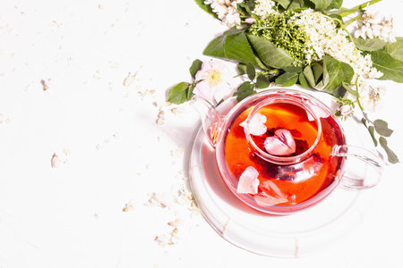 Assortment flowers tea. Fresh elderberry, rose hip, and acacia. Healthy food concept. White plaster...